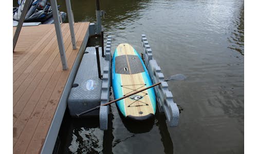 Photo of a Permalaunch kayak port with a stand-up paddleboard
