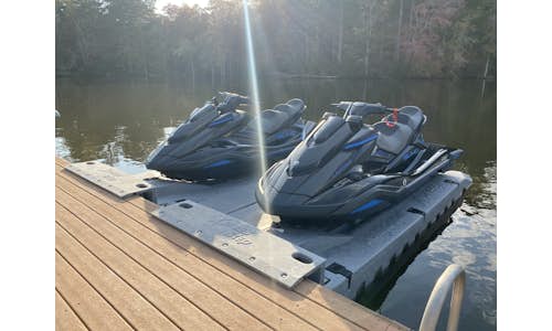 Photo of two Permaport Xpress drive-on jet ski docks mounted side-by-side